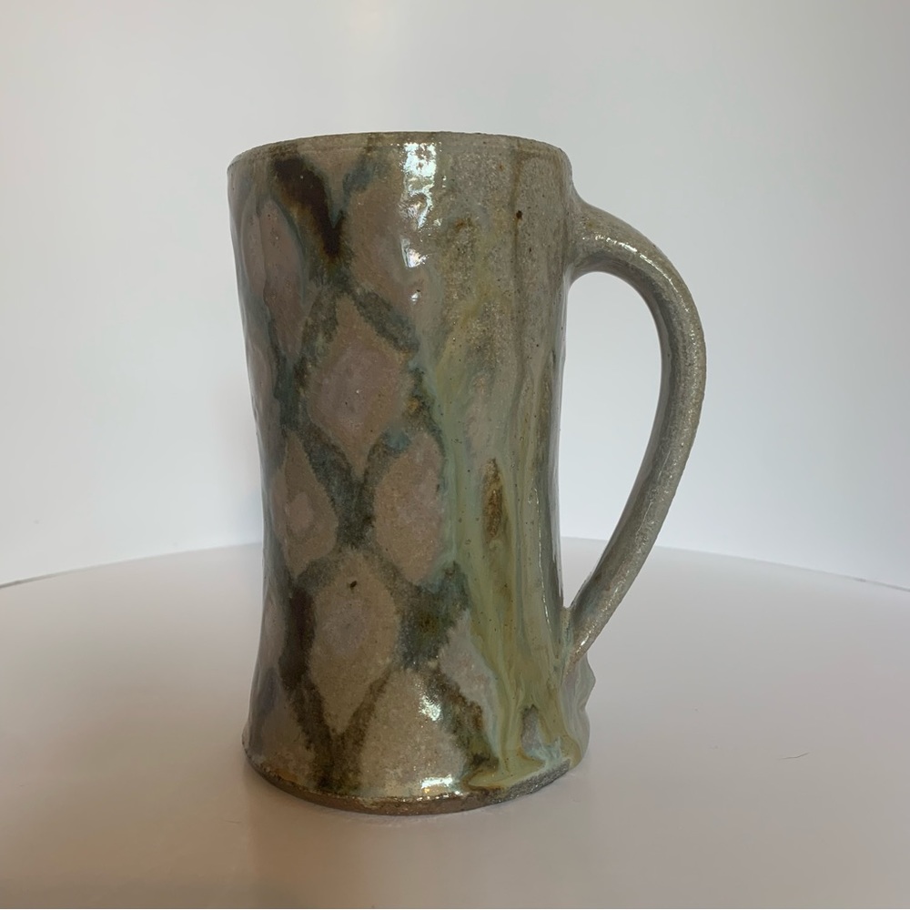 Glazed pottery coffee mug, pastel colors 5 1/2”, diamond pattern painted